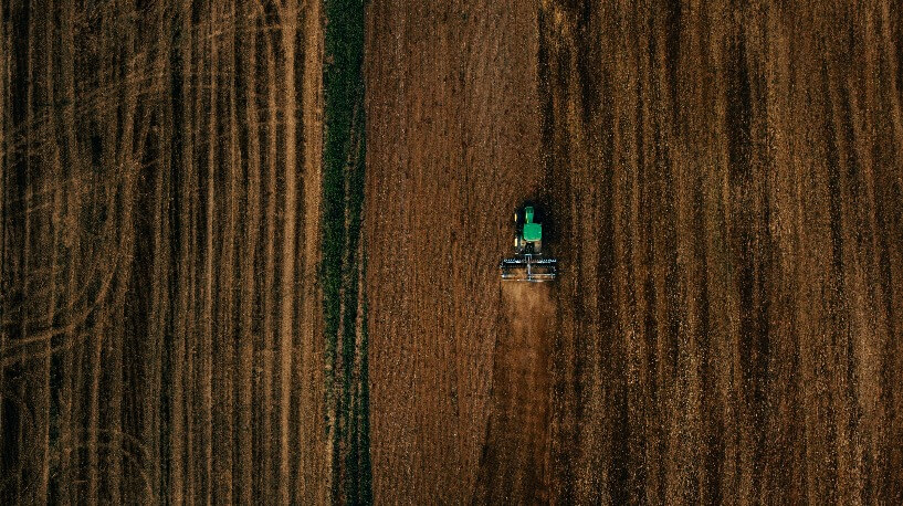 aerial view of a farm being tilled